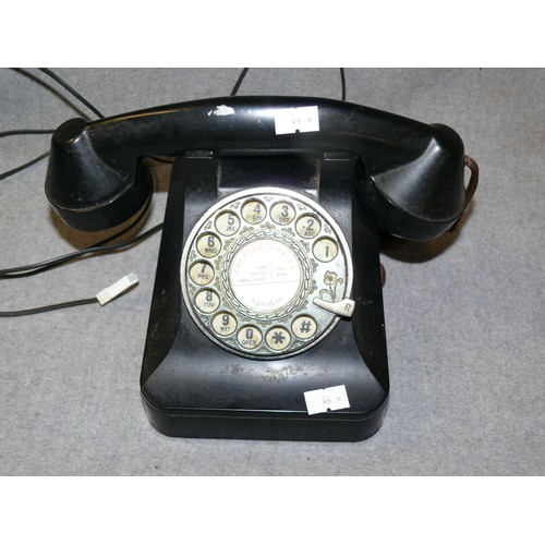 201 - A VINTAGE BLACK DIAL TELEPHONE WITH MODERN PLUG