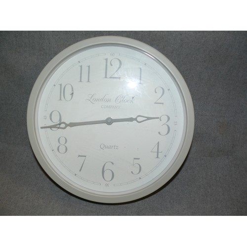 215 - CONTEMPORARY QUARTZ WALL CLOCK IN PALE GREY. LONDON CLOCK Co