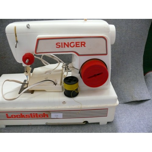 369 - CHILD'S LOCKSTITCH SEWING MACHINE IN RED CASE.