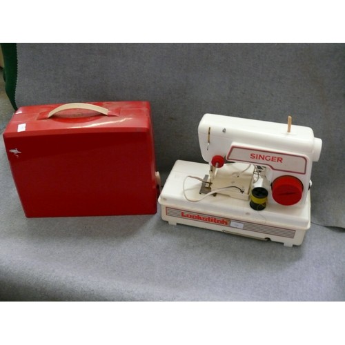 369 - CHILD'S LOCKSTITCH SEWING MACHINE IN RED CASE.