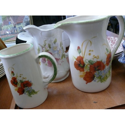 386 - 3 LARGE CERAMIC JUGS, 2 LARGE DISHES, A STONEWARE TEA CADDY AND 2 SMALL 2 HANDLED BOWLS.