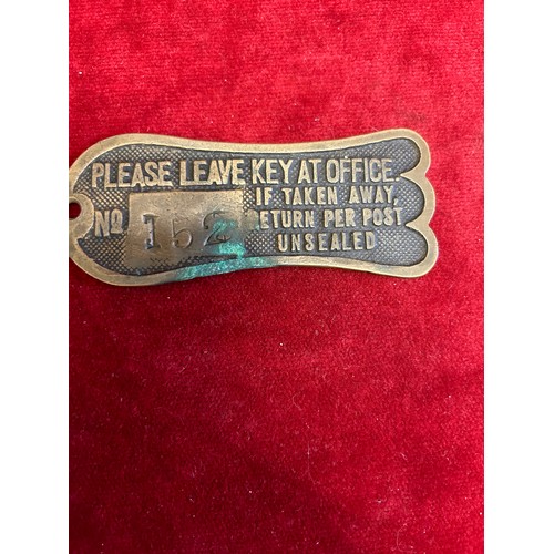 12 - A VINTAGE BRASS KEY RETURN KEY FOB  FROM THE RAILWAYS GREAT EASTERN HOTEL WITH PREPAID 2.5 PENCE STA... 