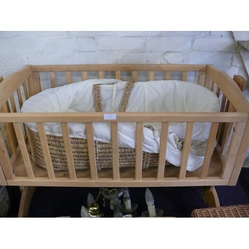 194 - A WOODEN SWINGING CRIB (NEEDS TLC) PLUS A MOSES BASKET