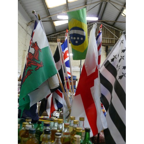 333 - COLLECTION OF SMALL FLAGS ON WOODEN DOWEL. INC UNION JACK, CORNISH FLAG, WELSH ETC.