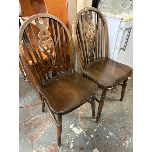 423 - PAIR OF DARK WOOD WHEELBACK DINING CHAIRS