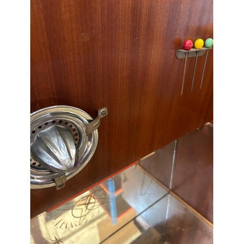 459 - 1950'S COCKTAIL CABINET WITH CANTILEVER TOP AND FITTED ACCESSORIES