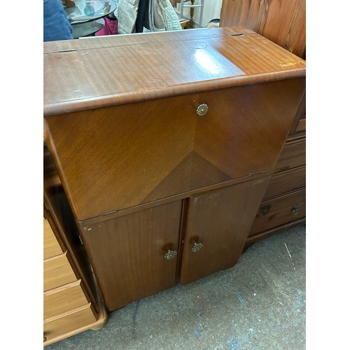 459 - 1950'S COCKTAIL CABINET WITH CANTILEVER TOP AND FITTED ACCESSORIES