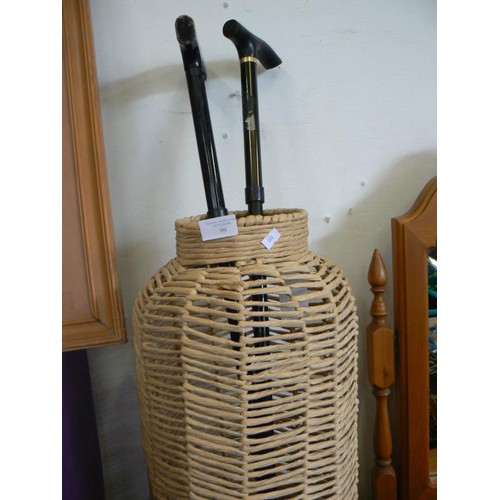 99 - A VINTAGE WICKER UMBRELLA/STICK STAND WITH WALKING STICKS