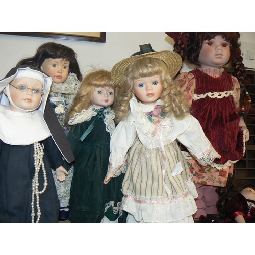 119 - A COLLECTION OF 6 PORCELAIN DOLLS