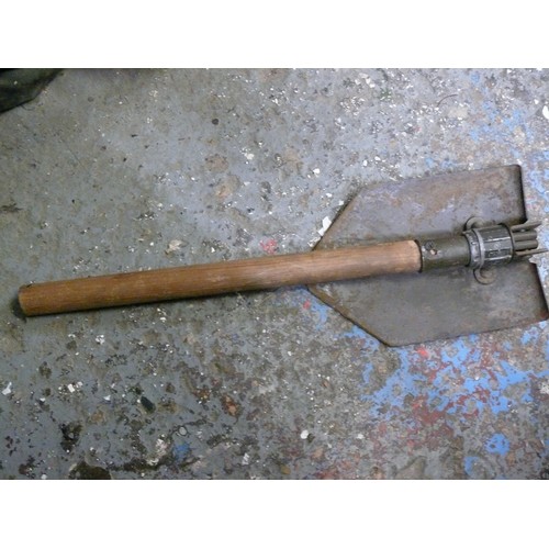 148 - GREEN BAG WITH CONTENTS OF GUN BOOKS, MINI CAR BOOKS, TRENCHING TOOL AND WEIGHT LIFTING BELT