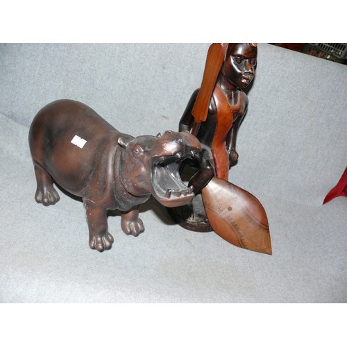 169 - CARVED WOODEN MASAAI WARRIOR AND A CERAMIC HIPPO