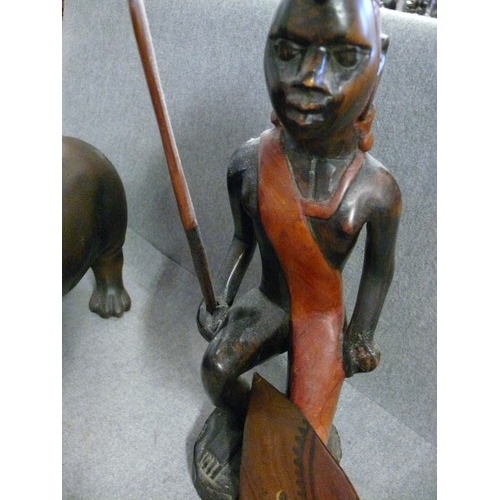 169 - CARVED WOODEN MASAAI WARRIOR AND A CERAMIC HIPPO