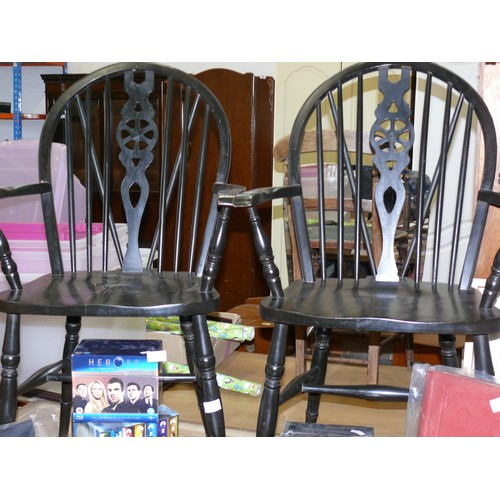 217 - PAIR OF STURDY BLACK PAINTED WHEEL-BACK WINDSOR CHAIRS WITH ARMS.