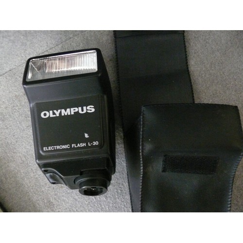 244 - OLYMPUS ELECTRONIC FLASH L-30. TOGETHER WITH OLYMPUS 35MM PHOTOGRAPHERS HANDBOOK.