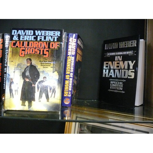 267 - 17 X DAVID WEBER HARDBACK BOOKS. INC A SIGNED COPY OF 'IN ENEMY HANDS'. ALL ARE IN GOOD CONDITION CO... 