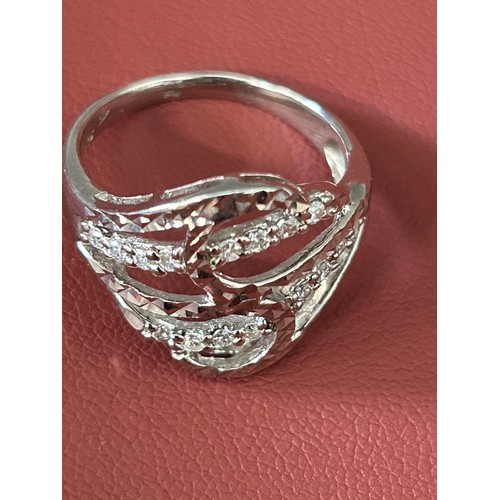 38 - A FINE SOLID SILVER DRESS RING WITH COVERED IN CUT CRYSTAL STONES SIZE P