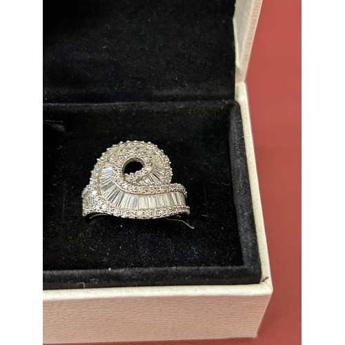 34 - SOLID SILVER DRESS RING ENCRUSTED WITH CUT CRYSTAL SIZE M