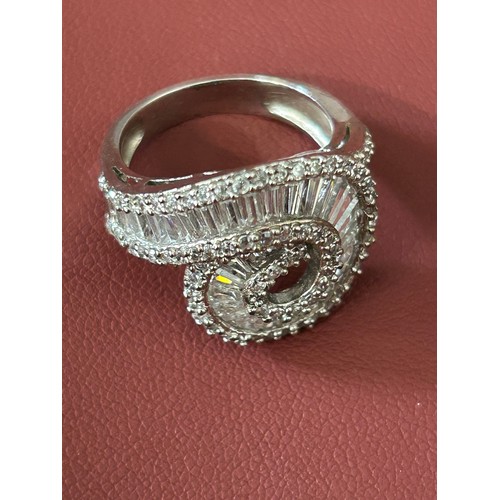 34 - SOLID SILVER DRESS RING ENCRUSTED WITH CUT CRYSTAL SIZE M