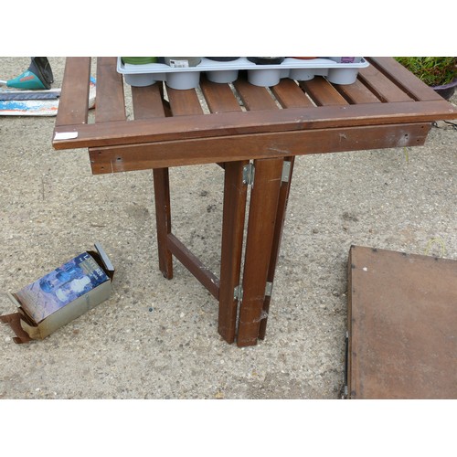 414 - A SOLID WOOD FOLDING TABLE