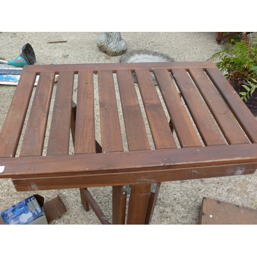 414 - A SOLID WOOD FOLDING TABLE