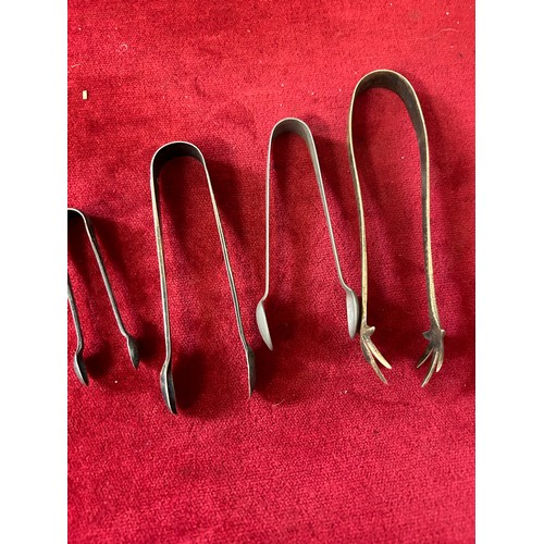 33 - COLLECTION OF 4 SUGAR NIPS OR TONGS S/PLATE