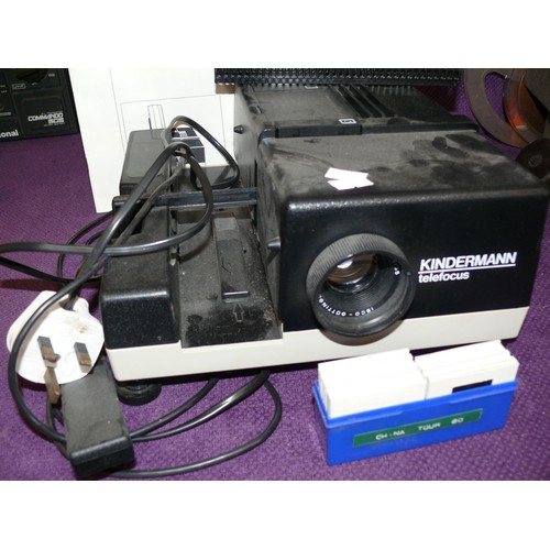 113 - KINDERMEN SLIDE PROJECTOR PLUS CAROUSEL AND A BELL & HOWELL PROJECTOR WITH REELS