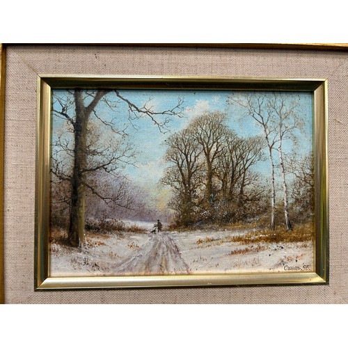 150 - J Caesar-Smith. A small original oil painting on board of a winter landscape with distant figure gat... 