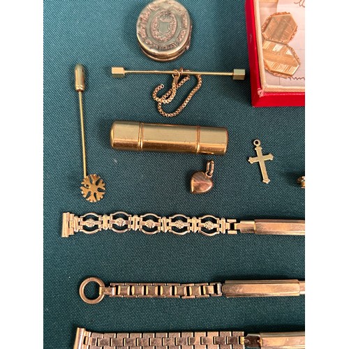 42 - Gold, rolled gold and gold metal oddments of jewellery, pins, watchstraps etc. Includes a small 9ct ... 