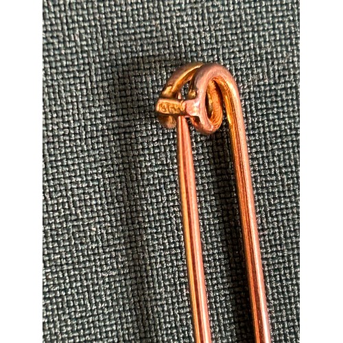 40 - An Antique 9ct rose gold stock pin and another 12ct rolled gold stock pin