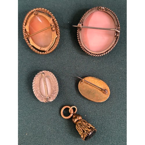 55 - 3 Cameo brooches including a small 19th Century example, a porcelain buckle and an antique seal fob ... 