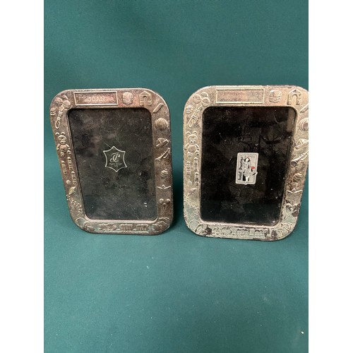 36 - Two sterling silver photograph frames embossed with decoration of toys, one engraved 