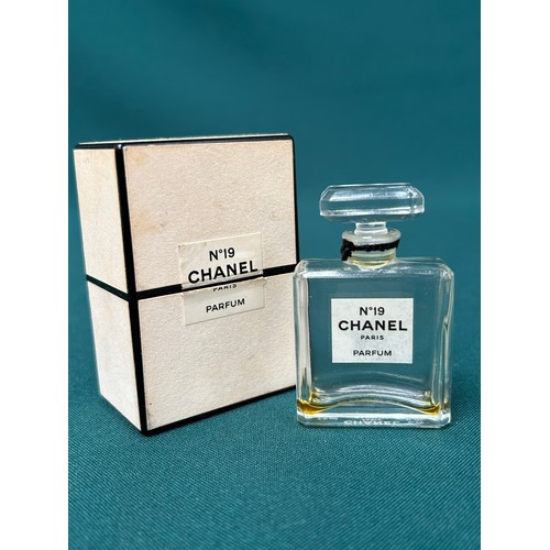 62 - A vintage Chanel No 19 glass scent bottle with stopper and original box - etched 