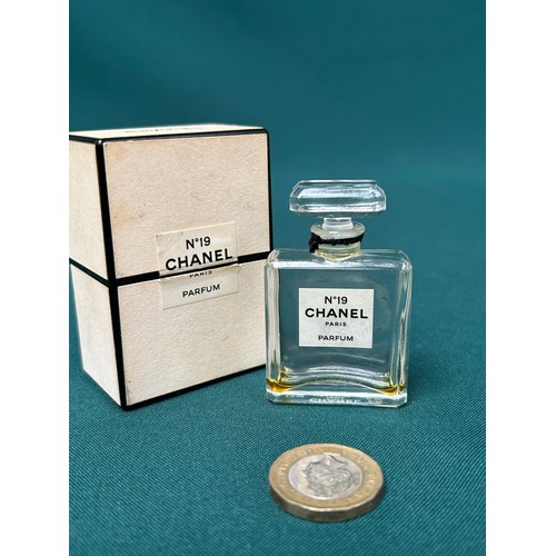 62 - A vintage Chanel No 19 glass scent bottle with stopper and original box - etched 