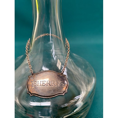 203 - Heavy glass decanter and stopper with silver plated Sherry label