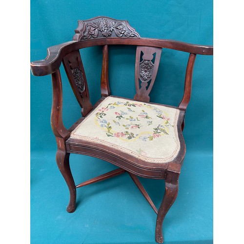 511 - Edwardian mahogany corner chair with carved back rail and splats and with hand worked tapestry seat