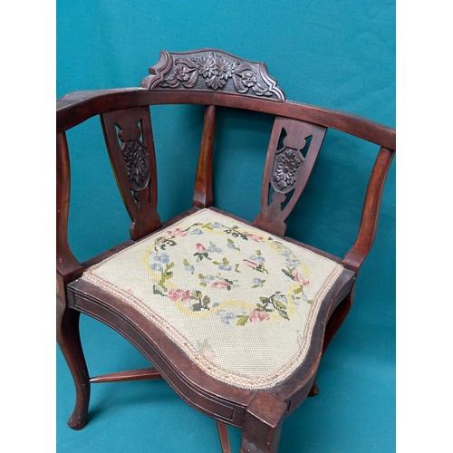 511 - Edwardian mahogany corner chair with carved back rail and splats and with hand worked tapestry seat