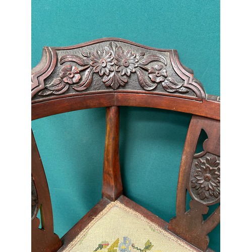 511 - Edwardian mahogany corner chair with carved back rail and splats and with hand worked tapestry seat