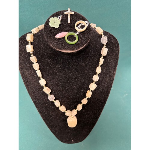 54 - Selection of jade and stone jewellery to include a jade flower pendant with 925 silver back and loop... 