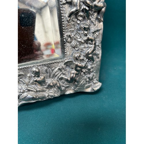 34 - Good quality silver plated dressing table mirror, heavily embossed with cherubs and putti