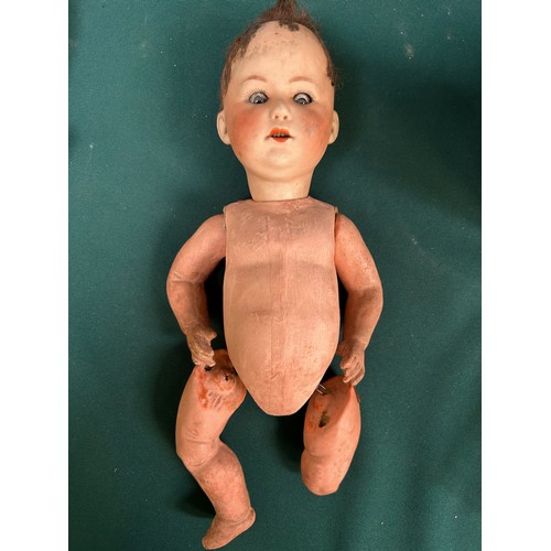 342 - An antique German bisque headed doll with composition body AF. The head with glass eyes, makers mark... 