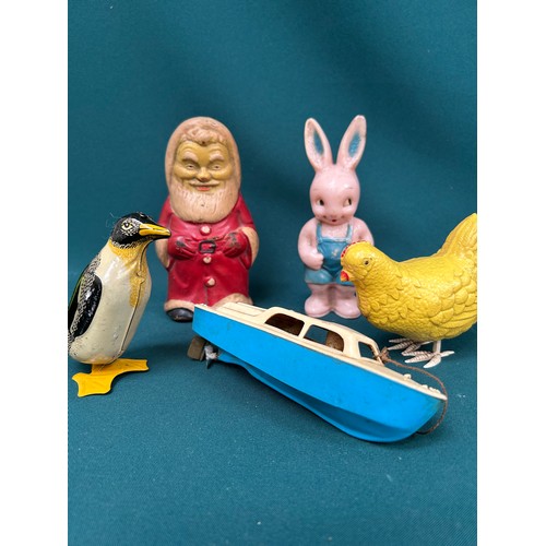 345 - 1940's & 50's children's toys to include a rubber Father Christmas, a clockwork penguin 