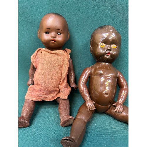 343 - A circa 1930's black doll with composition body & head and moving glass eyes, probably the original ... 