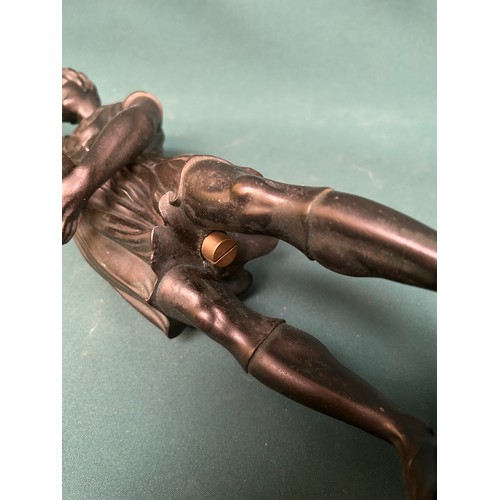 280 - Large metal figural candlestick or lamp base - in the form of a Grecian holding a torch. 57cm