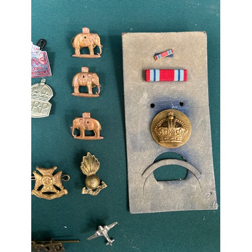 128 - Mostly Military badges including WW1 Munitions 