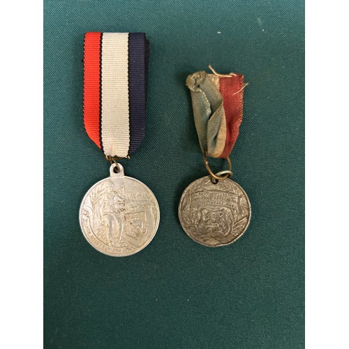 132 - Two WW1 Peace Medals on ribbons 1919