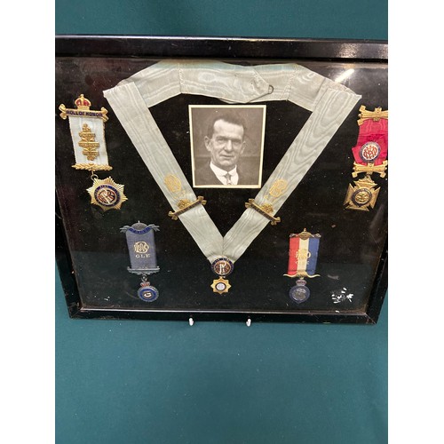 121 - A framed collection of 1930's & 40's  Royal Antediluvian Order of Buffaloes medals and jewels, with ... 