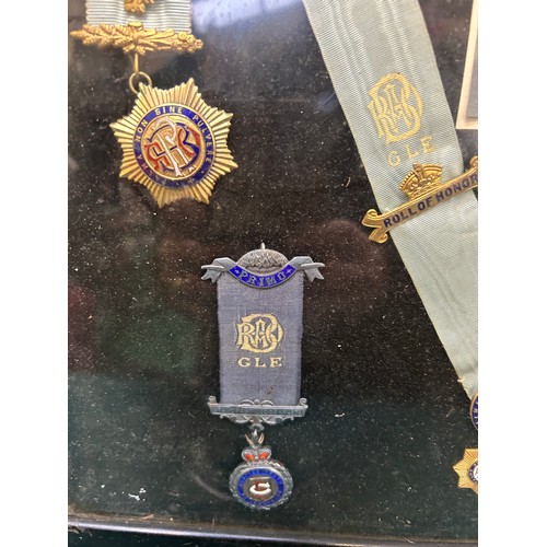 121 - A framed collection of 1930's & 40's  Royal Antediluvian Order of Buffaloes medals and jewels, with ... 