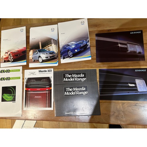 395 - Automobilia Ephemera / Car Brochures: Mazda including :- Mazda 2 (2004), Mazda 3 (2004), RX8 (2004),... 