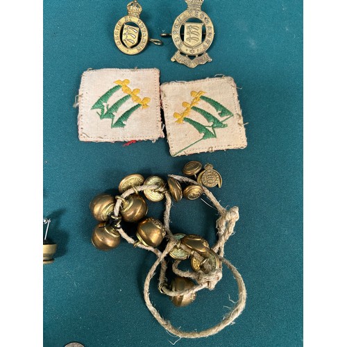 138 - WW1 and later cap badges, buttons, lapel badges to include The Essex Regt Cap Badge, Essex Yeomanry ... 