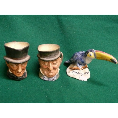 87 - 2 MINIATURE ROYAL DOULTON CHARACTER JUGS AND A COLOURFUL CERAMIC TOUCAN AVIFAUNA HOLLAND